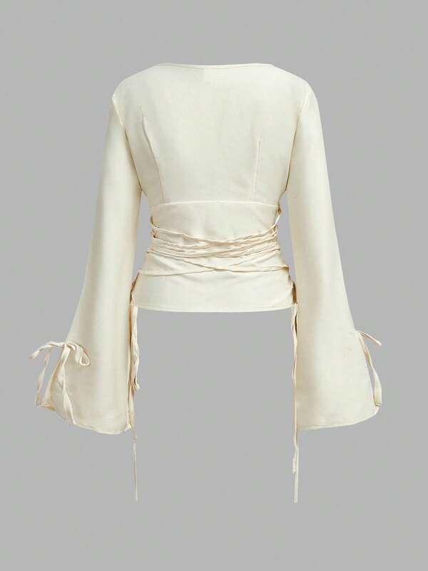 MISSGUIDED Plunge Neck Bell Sleeve Lace Up Blouse