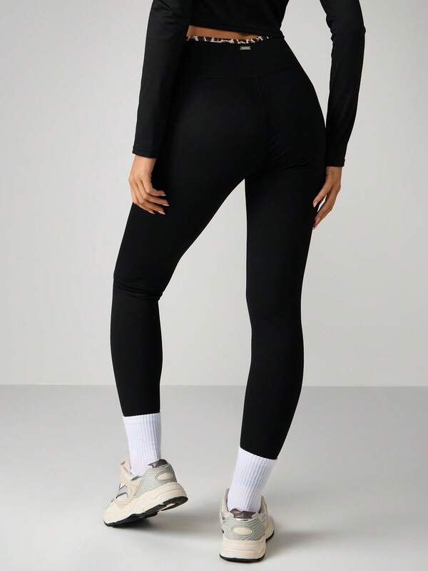 Missguided X Playboy Cross Over Waistband Sports Leggings With Leopard Print