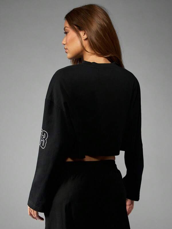 Missguided X Playboy Long Sleeve Cropped Graphic Tee With Racing Design