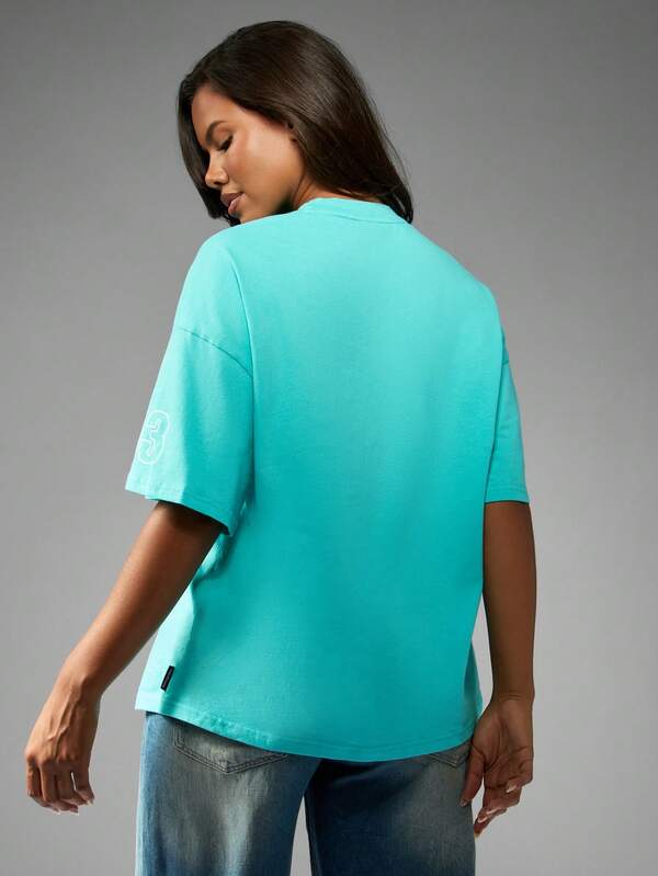 Missguided X Playboy Oversized Turquoise Tee With Racing Club Print