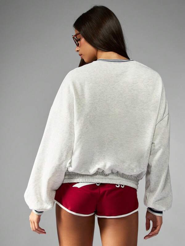 Missguided X Playboy Varsity Graphic Crew Neck Sweatshirt With Elastic Hem