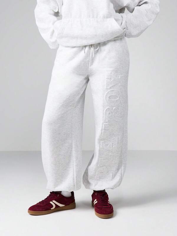 Missguided x Playboy Wide Leg Cuffed Joggers With Embossed Logo Pattern